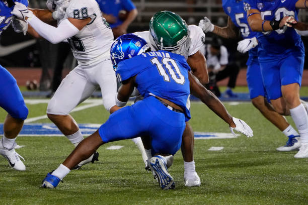 Buffalo Bulls Safety Marcus Fuqua tackles Wagner Seahawks Wide Receiver Naiem Simmons running with the ball during the second half of a NCAA Football...