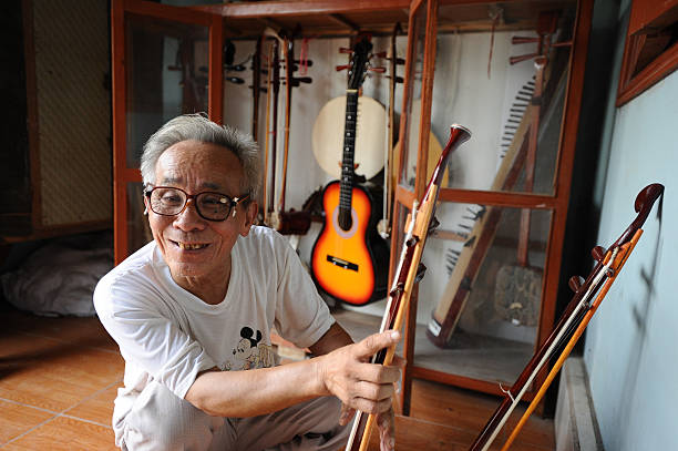 Bui Van Vuoc shows the traditional music instruments at his gallery in Vinh Bao on September 19 2015 in Hai Phong Vietnam 81yearsold Bui Van Vuoc of...