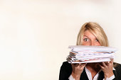 Business woman hold stack of Junk Mail and unpaid bills