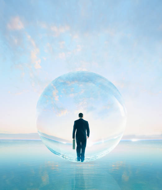 Businessman in bubble walking on water