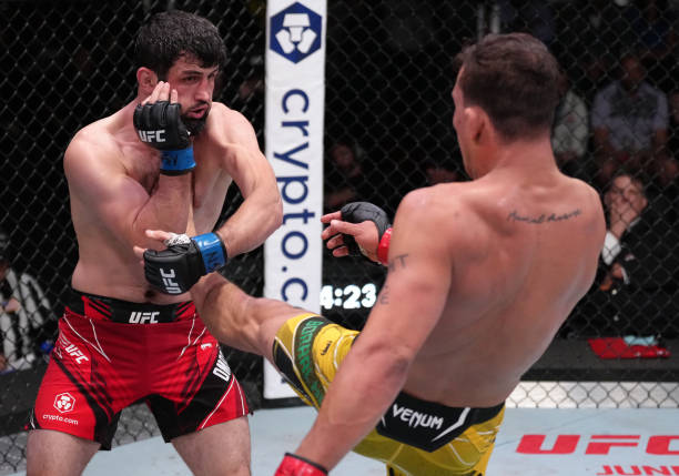 Caio Borralho of Brazil kicks Gadzhi Omargadzhiev of Russia in a middleweight fight during the UFC Fight Night event at UFC APEX on April 16, 2022 in...
