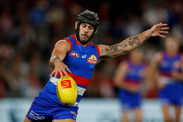 Caleb Daniel of the Bulldogs kicks the ball during the 2022 AFL Round 03 match between the Western Bulldogs and the Sydney Swans at Marvel Stadium on...