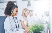 Call center worker accompanied by her team.