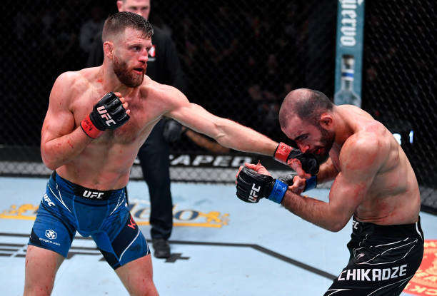 Calvin Kattar punches Giga Chikadze of Georgia in their featherweight fight during the UFC Fight Night event at UFC APEX on January 15, 2022 in Las...