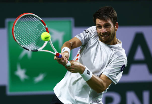 Cameron Norrie of Great Britain plays a backhand against Nikoloz Basilashvili of Georgia in their third round match on Day 8 of the BNP Paribas Open...
