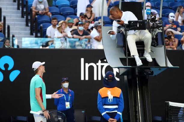 Canada's Denis Shapovalov speaks with the umpire while playing against Spain's Rafael Nadal during their men's singles quarter-final match on day...