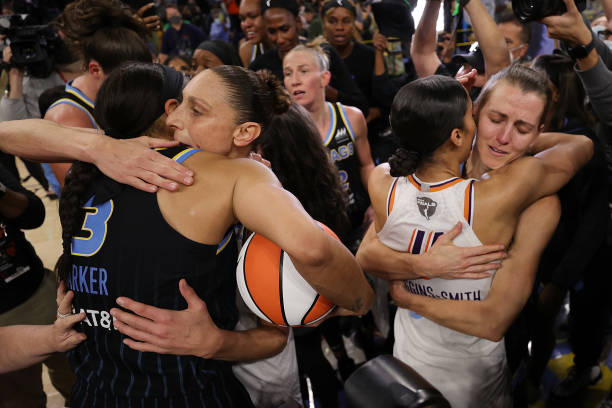 Candace Parker of the Chicago Sky hugs Diana Taurasi of the Phoenix Mercury and Skylar Diggins-Smith of the Phoenix Mercury hugs Allie Quigley of the...