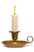 Candle in brass holder isolated