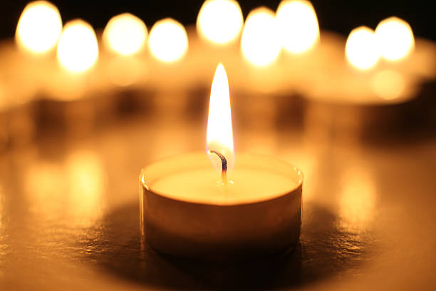 Candle in front of a group of candles