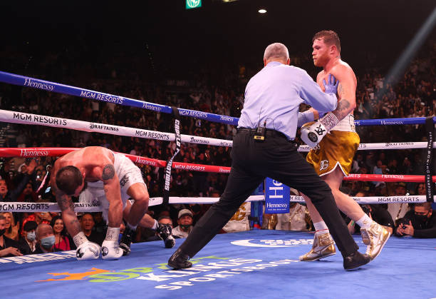 Canelo Alvarez knocks down Caleb Plant during their championship bout for Alvarez's WBC, WBO and WBA super middleweight titles and Plant's IBF super...