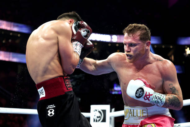 Canelo Alvarez punches Dmitry Bivol during their WBA light heavyweight title fight at T-Mobile Arena on May 07, 2022 in Las Vegas, Nevada. Bivol...