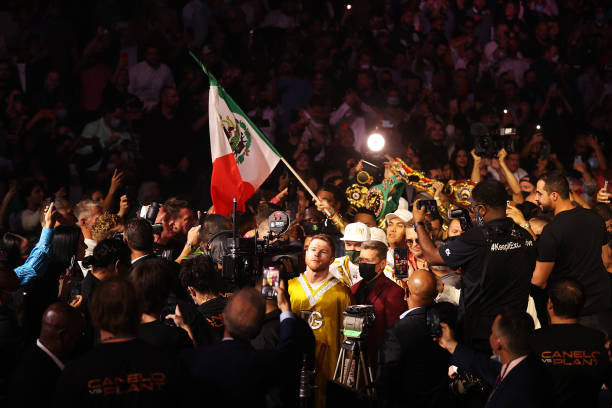 Canelo Alvarez walks into the ring before his championship bout for Alvarez's WBC, WBO and WBA super middleweight titles and Plant's IBF super...