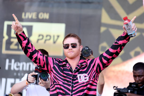 Canelo Alvarez waves to the crowd during a ceremonial weigh-in at Toshiba Plaza on May 06, 2022 in Las Vegas, Nevada. Alvarez will challenge WBA...