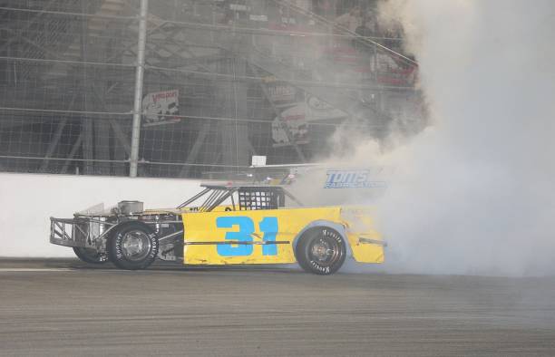 car-number-31-performs-a-burnout-at-the-cisco-burger-world-figure-8-picture-id72116889