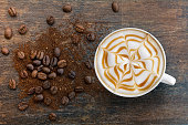 Caramel cappuccino with ground top view.