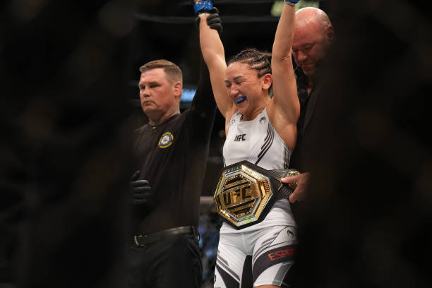 Carla Esparza celebrates her victory over Rose Namajunas in their Women's Strawweight bout during the UFC 274 event at Footprint Center on May 7 in...