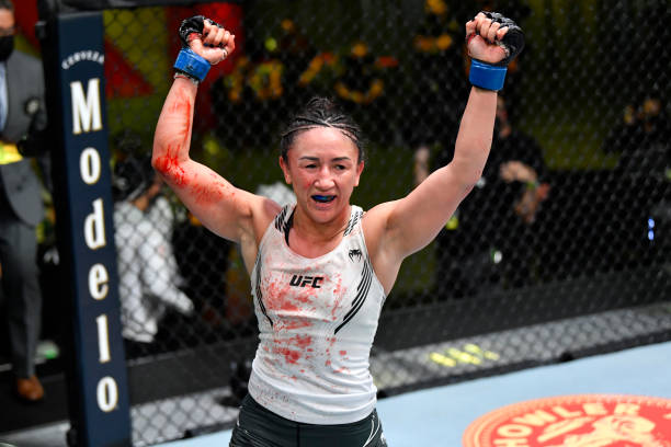 Carla Esparza reacts after defeating Yan Xiaonan of China in their women's strawweight bout during the UFC Fight Night event at UFC APEX on May 22,...