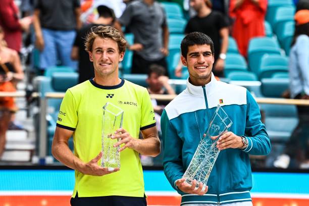 Carlos Alcaraz , of Spain, and Casper Ruud, of Norway, pose after the mens single finals at the 2022 Miami Open presented by Ita? at Hard Rock...