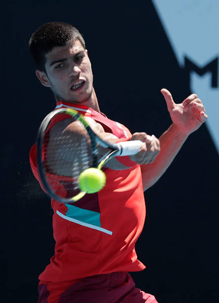 Carlos Alcaraz of Spain plays a forehand in his second round singles match against Dusan Lajovic of Serbia during day three of the 2022 Australian...