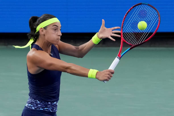 Caroline Garcia of France plays a backhand during her match against Jessica Pegula of the United States during their match on day seven of the...