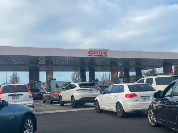 cars are waiting to pump gas at a costco gas station the conflict picture
