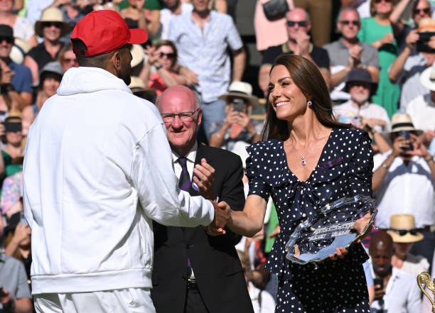 Catherine, Duchess of Cambridge presents the Runners Up Dish to Nick Kyrgios at the Wimbledon Men's Singles Final at All England Lawn Tennis and...