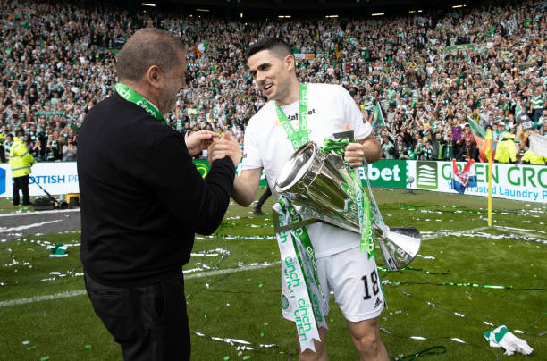 Celtic manager Ange Postecoglou and Tom Rogic with the Premiership Trophy during a cinch Premiership match between Celtic and Motherwell at Celtic...