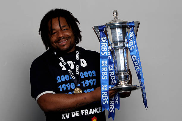 PARIS - MARCH 20: Centre Mathieu Bastareaud of France celebrates with the trophy after winning the Grand Slam and Championship during the RBS Six Nations Championship match between France and England at the Stade de France on March 20, 2010 in Paris, France. (Photo by David Rogers/Getty Images)