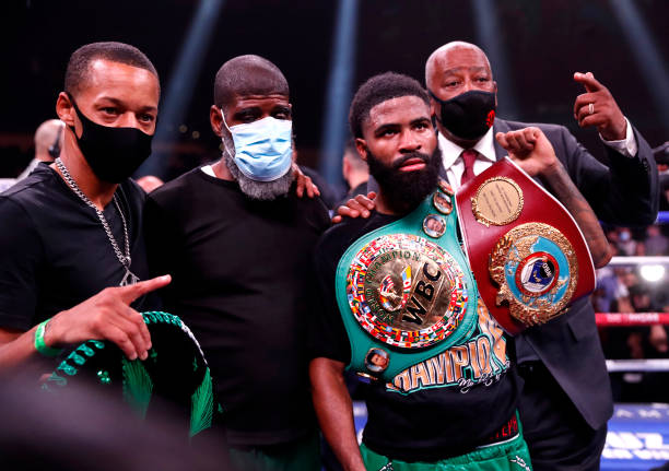 Champion Stephen Fulton Jr. Poses with members of his team after defeating WBC champion Brandon Figueroa in a super bantamweight title unification...