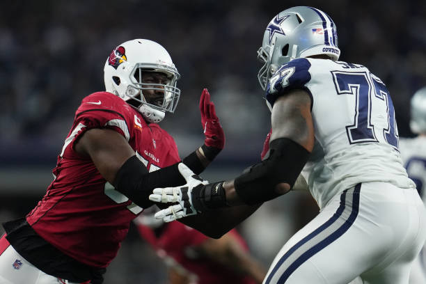 Chandler Jones of the Arizona Cardinals battles with Tyron Smith of the Dallas Cowboys during an NFL game at AT&T Stadium on January 02, 2022 in...