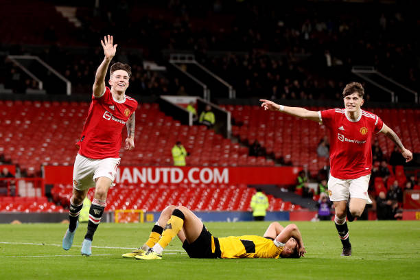 Charlie McNeill of Manchester United celebrates after scoring their sides third goal during the FA Youth Cup Semi Final match between Manchester...