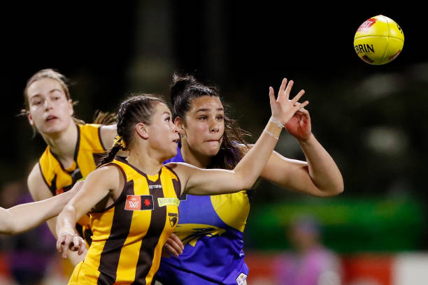 Charlotte Baskaran of the Hawks and Sarah Lakay of the Eagles compete for the ball during the 2022 S7 AFLW Round 06 match between the Hawthorn Hawks...