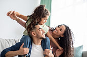 Cheerful Middle Eastern Family Of Three Having Fun Together At Home