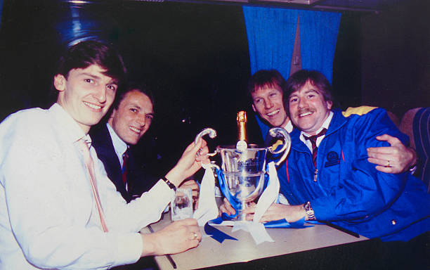 Chelsea's Colin Pates, John Bumstead, Doug Rougvie and Club Photographer Hugh Hastings on the team coach after the game.