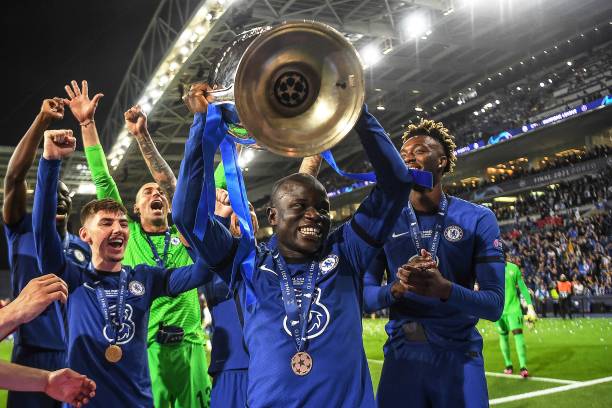 Chelsea's French midfielder N'Golo Kante lifts the trophy after winning the UEFA Champions League final football match between Manchester City and...