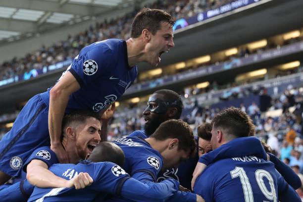 Chelsea's German midfielder Kai Havertz is congratulated by teammates after scoring a goal during the UEFA Champions League final football match...