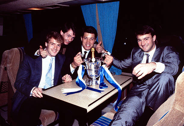 Chelsea's Kerry Dixon, Joe McLaughlin and Eddie Niedzwiecki after the game with the Full Members' Cup Trophy.