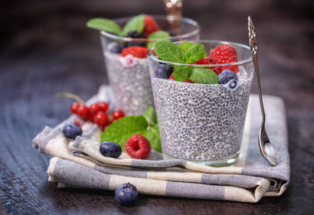 chia seed pudding with fresh berries for the breakfast - chia pudding stock pictures, royalty-free photos & images