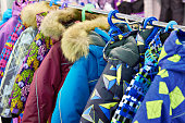 Children winter jackets on hanger in store