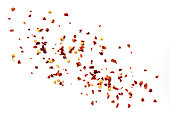 Chilli Flakes Scattered over White Background Top View