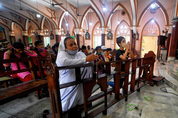 Christian devotees seen offering prayers during Good Friday in Kolkata. Good Friday is a Christian holiday commemorating the crucifixion of Jesus and...