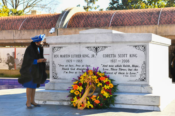 Christine King Farris is seen laying a wreath on the grave of Dr. Martin Luther King during the 2021 King Holiday Observance Beloved Community...