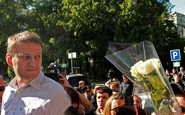 Circled by reporters and supporters Russian protest leader Alexei Navalny looks on after walking out of prison in Moscow, on May 24, 2012. Navalny,...