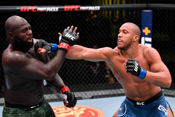 Ciryl Gane of France punches Jairzinho Rozenstruik of Suriname in a heavyweight bout during the UFC Fight Night event at UFC APEX on February 27,...