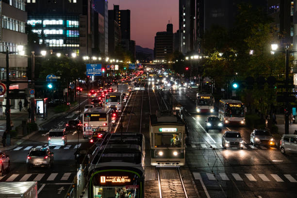city street in hiroshima city of japan - automotivas - fotografias e filmes do acervo