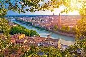 Ciy of Verona and Adige river aerial view through leaf frame, tourist destination in Veneto region of Italy
