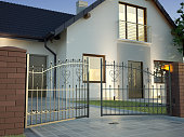 Classic Iron Gate and house