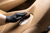 Cleaning leather car seat and upholstery with brush