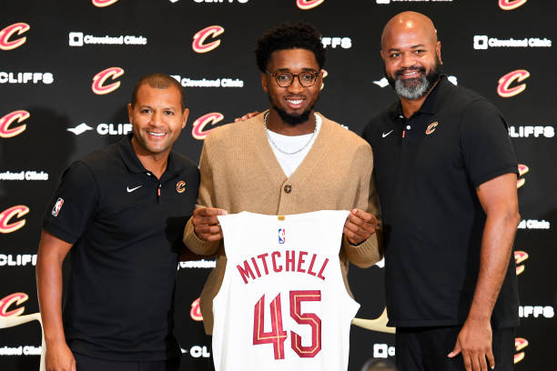 Cleveland Cavaliers president of basketball operations Koby Altman, Donovan Mitchell and head coach J. B. Bickerstaff pose for a photo during a press...