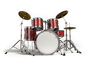 Close-up of red drum set on white background